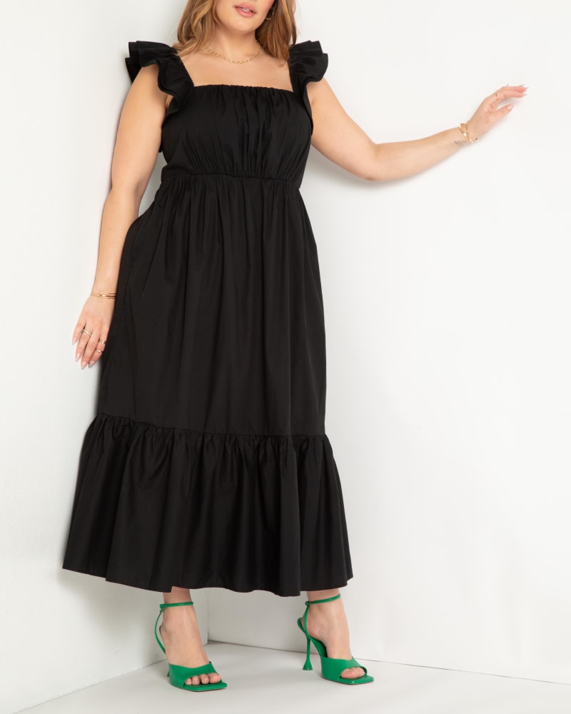 Front of a model wearing a size 14 Flutter Sleeve Maxi Dress in Black by ELOQUII. | dia_product_style_image_id:294161